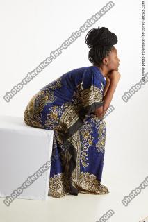 Dina Moses African Woman Sitting Pose